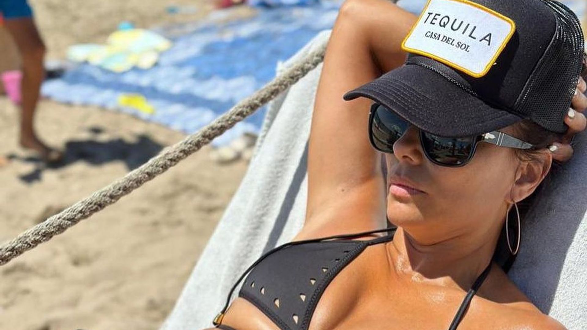 Eva Longoria sunbathing in a black bikini