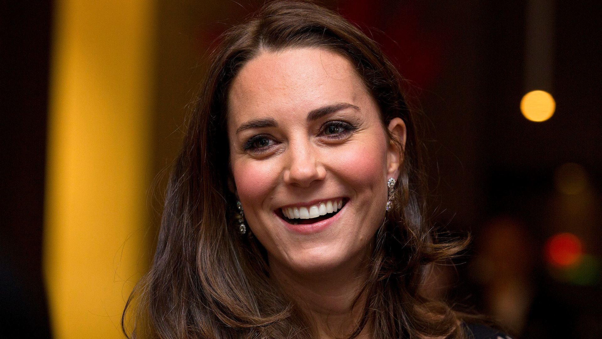 Catherine smiling close up in black dress