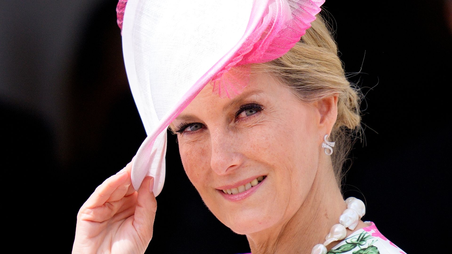 Sophie, Duchess of Edinburgh  in floral dress and pink fascinator