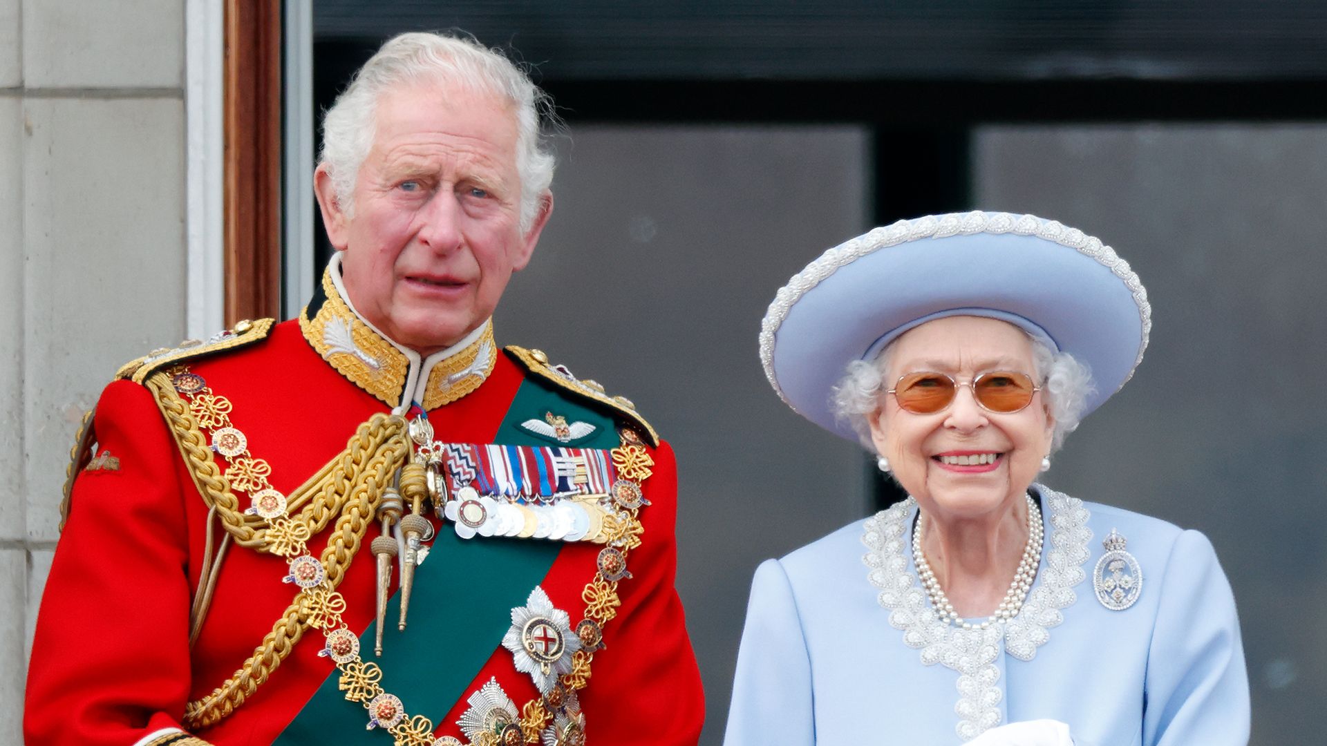 King Charles standing with Queen Elizabeth
