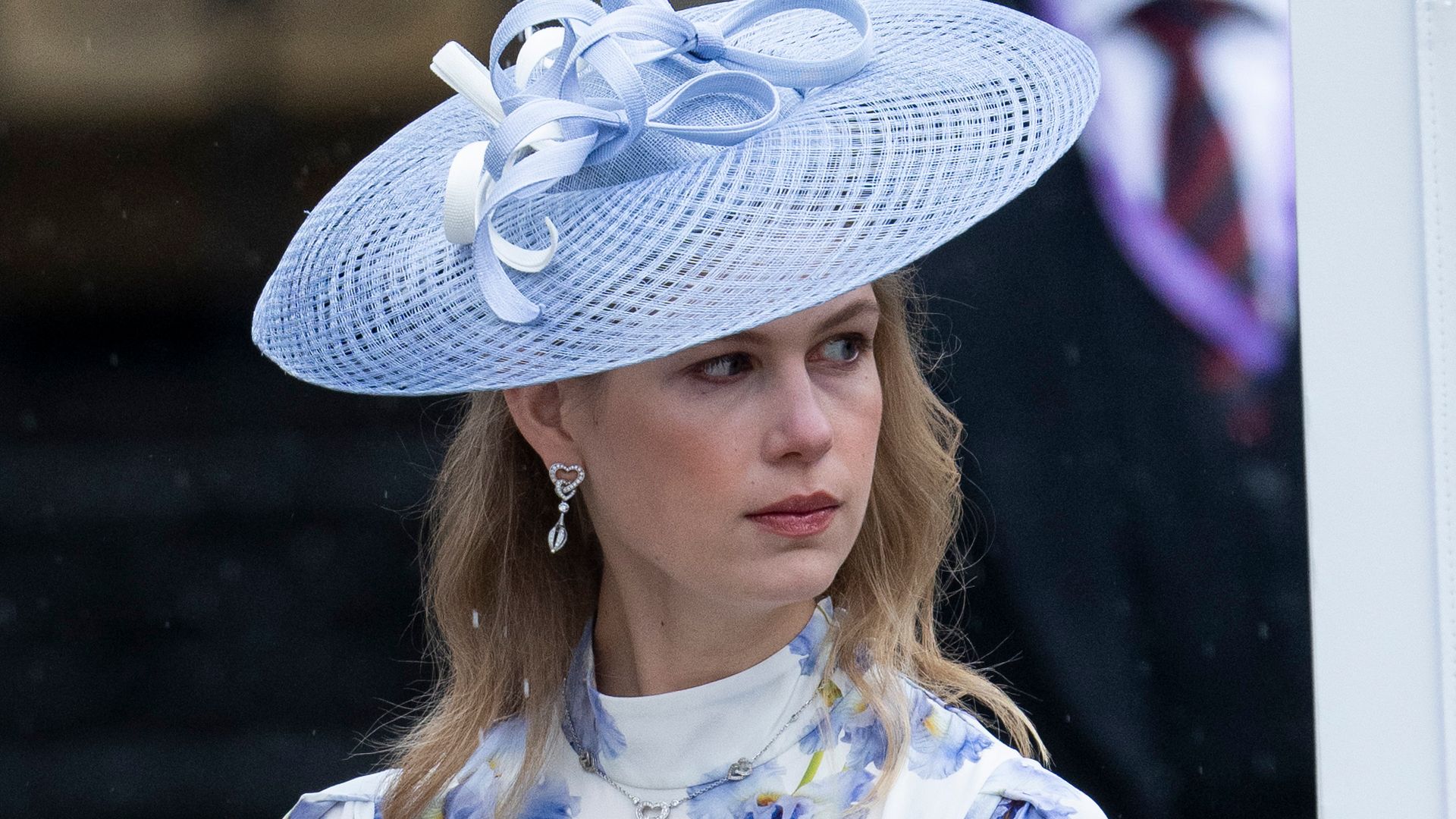 Lady Louise Windsor in blue hat and floral dress at  Westminster Abbey coronation of King Charles