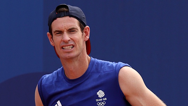 Andy Murray in a blue vest and cap