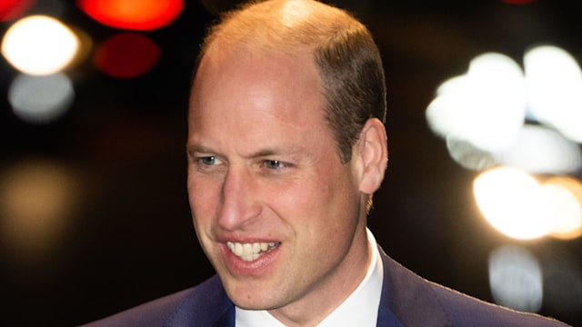 Prince William smiling in a suit