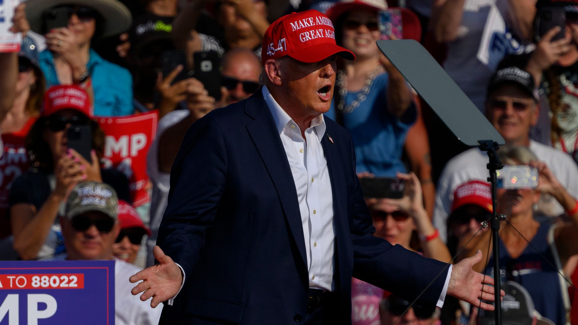 Republican presidential candidate, former U.S. President Donald Trump speaks at a rally at Butler Farm Show Inc. on July 13, 2024 in Butler, Pennsylvania. Shortly after, shots rang out and Trump slumped before being whisked away by Secret Service with injuries visible to the side of his head