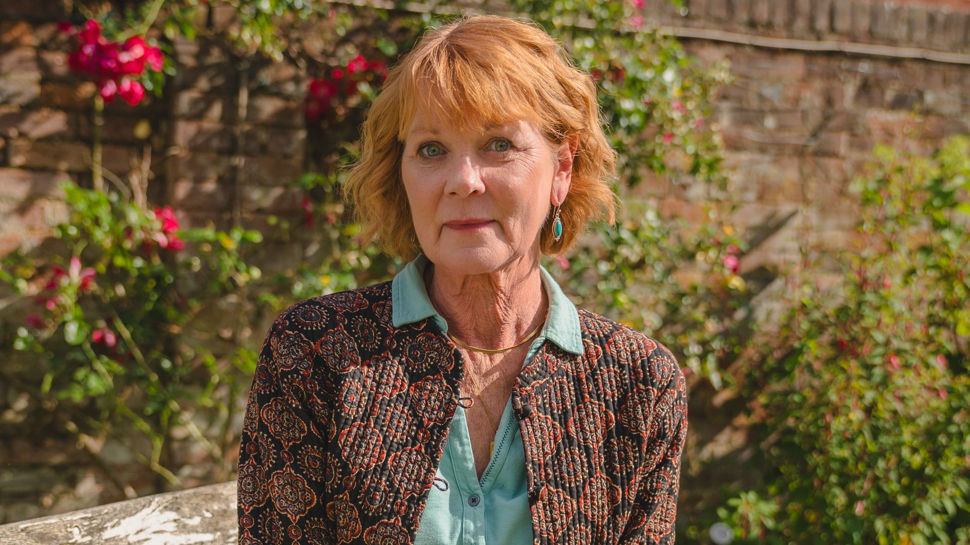 Woman sitting on park bench