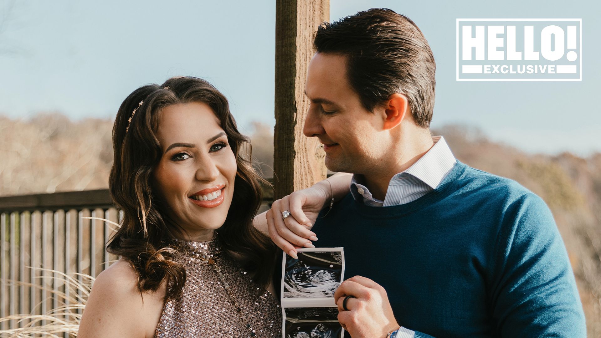 Ellie Phillips and Robert Dee holding baby scan for pregnancy reveal shoot