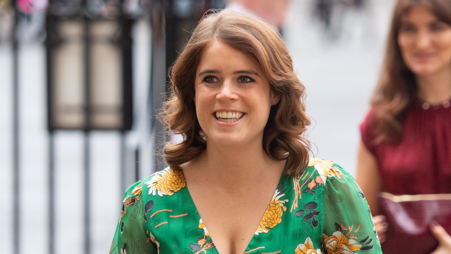 Princess Eugenie looks beautiful wearing a pleated skirt and Louis Vuitton bag