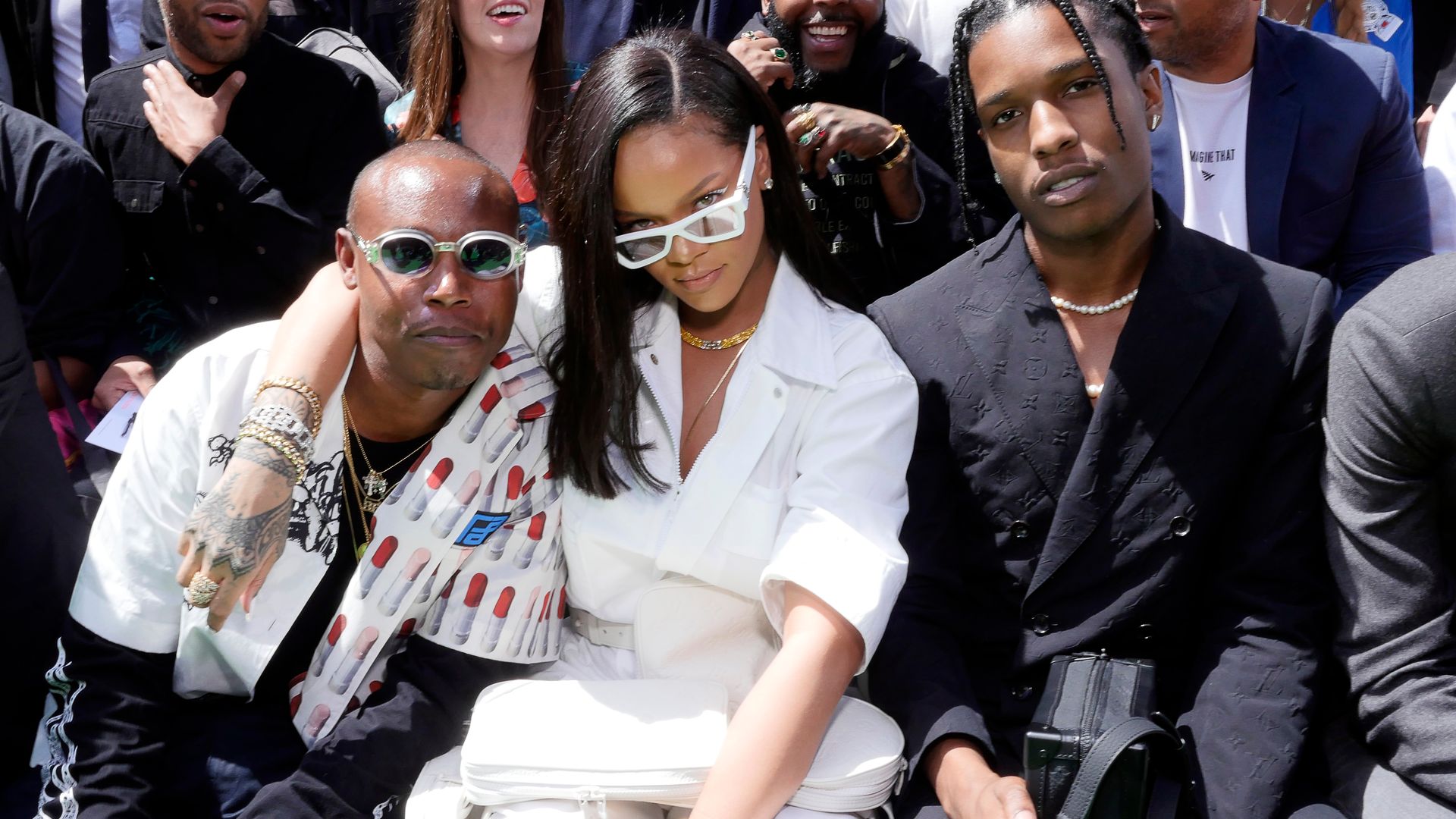 Rihanna and Asap Rocky sat with others at a fashion show