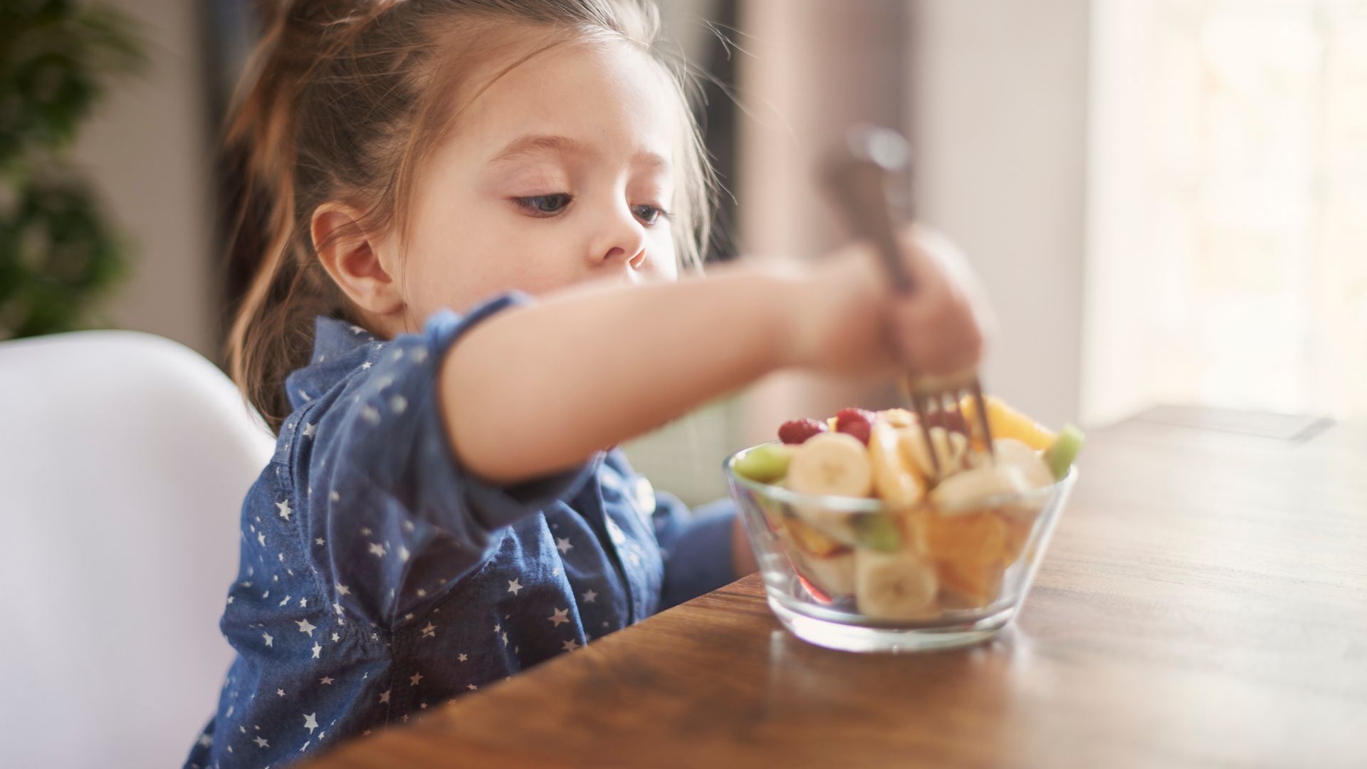 Child eating fresh fruit