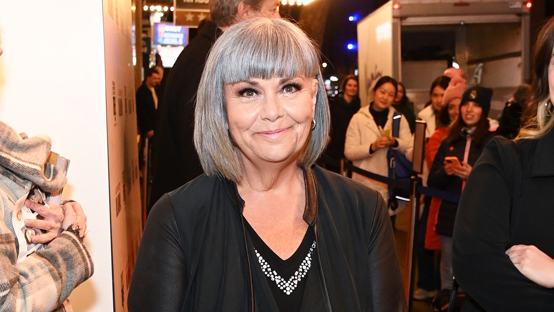 Dawn French looks unrecognisable with platinum hair and daring top