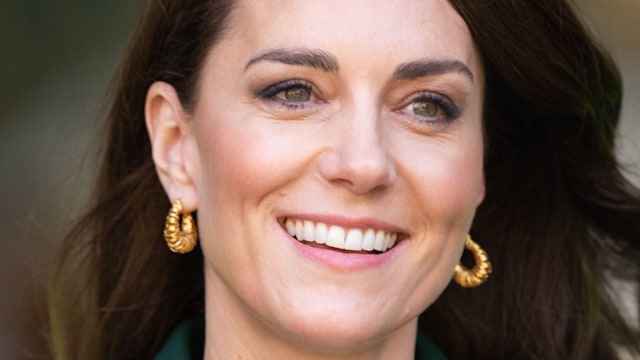 Kate Middleton wearing hoop earrings during tour of Kirkgate Market on January 31, 2023 in Leeds, England.  