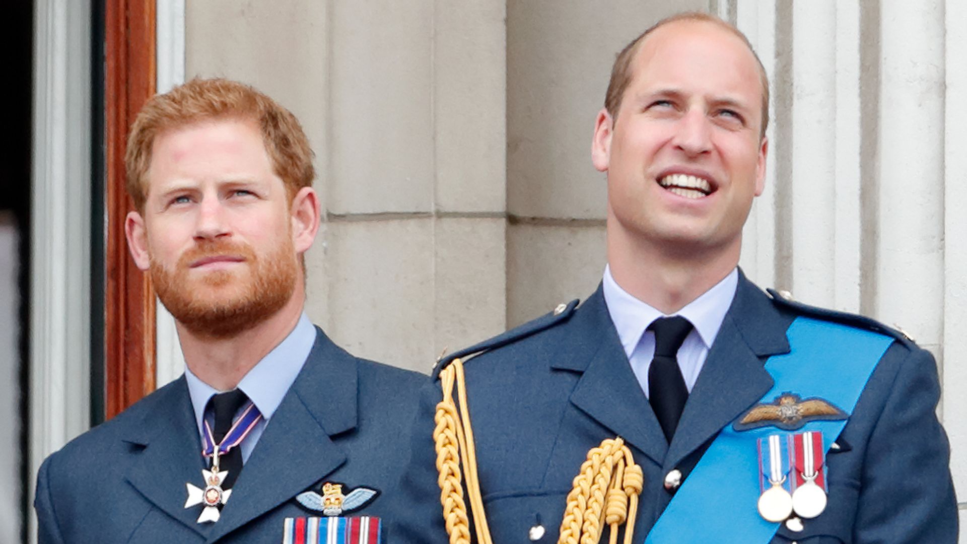 William and Harry on balcony in military uniform