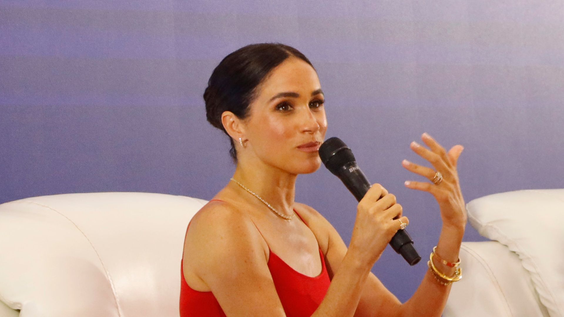 Meghan Markle says she 'loves being a mum' as she opens up about 'chatty' Archie and Lili