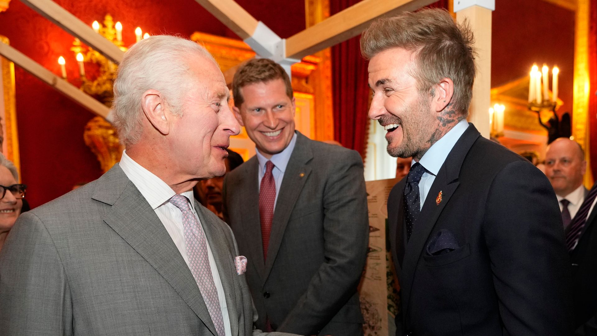 King Charles and David Beckham laughing together