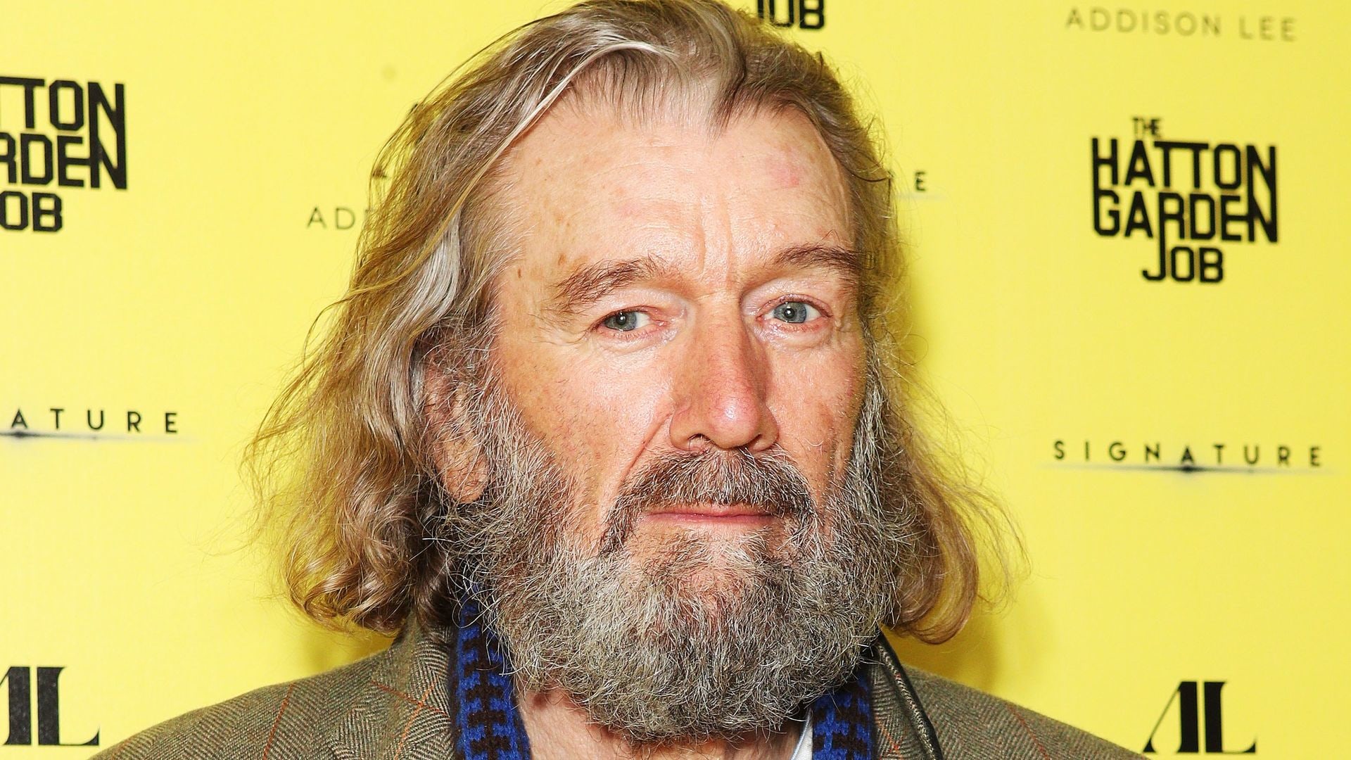 Clive Russell attending premiere in tweed jacket 