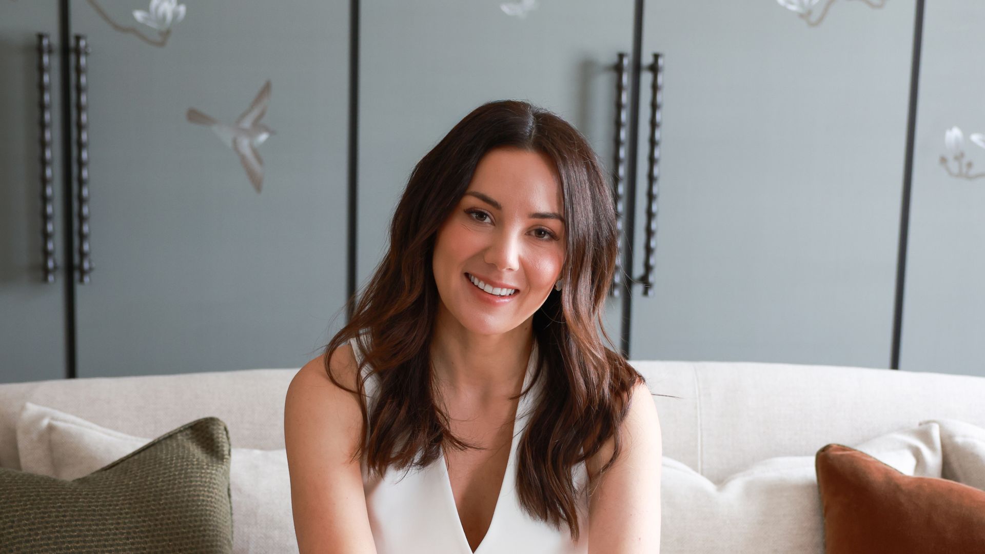 woman smiling on sofa 