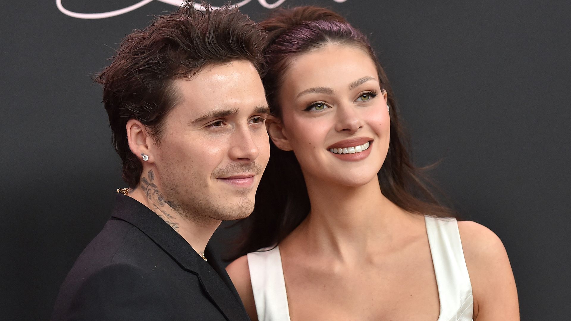 Brooklyn Beckham and Nicola Peltz smiling