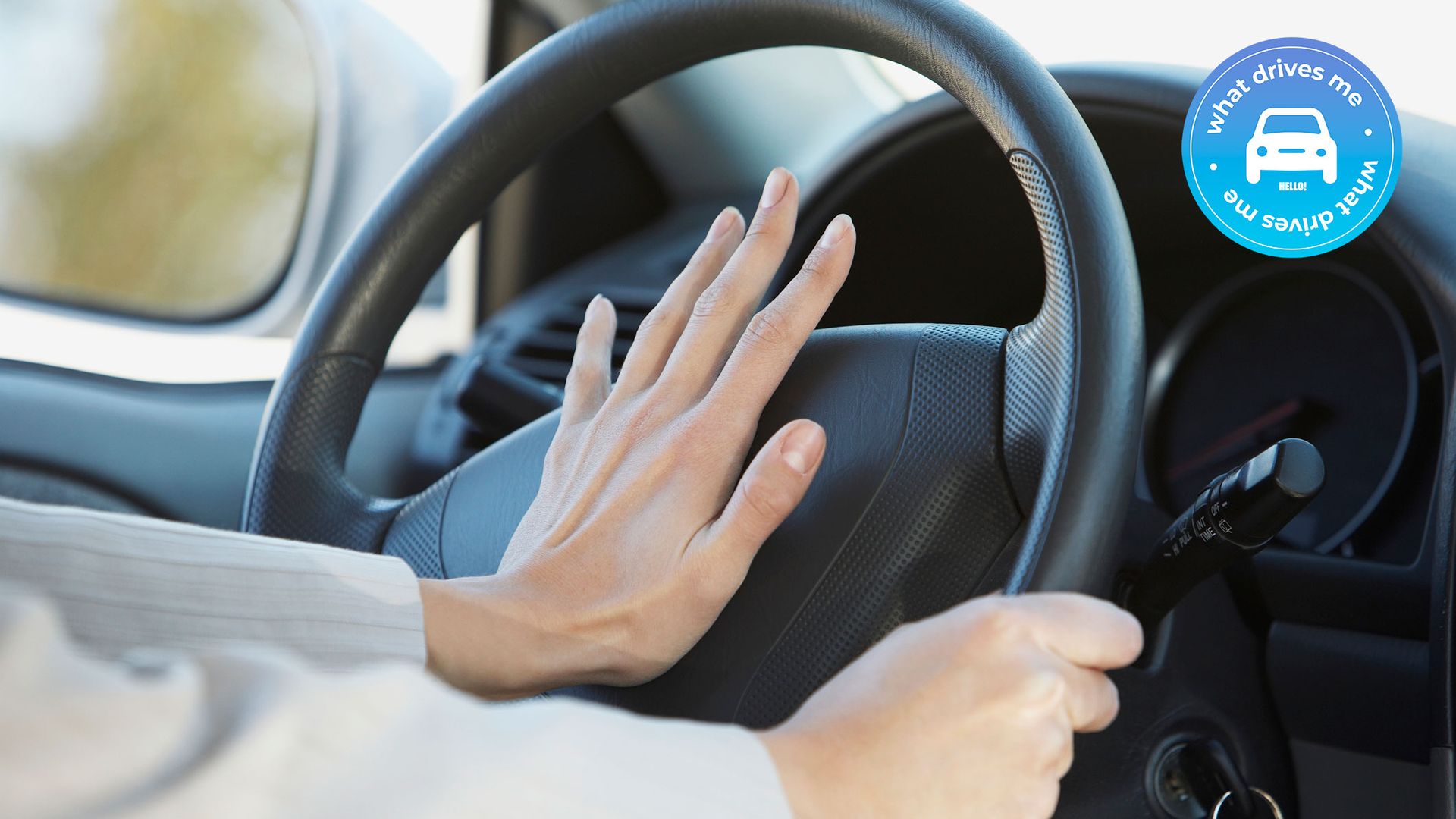 Womans hands on steering wheel