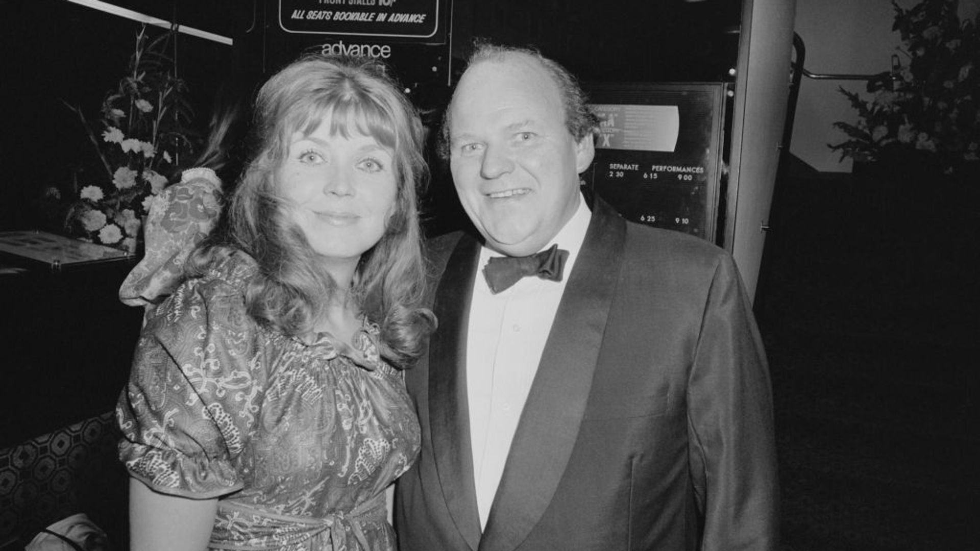 Roy Kinnear with wife Carmel Cryan at a premiere. He is wearing a tux. 