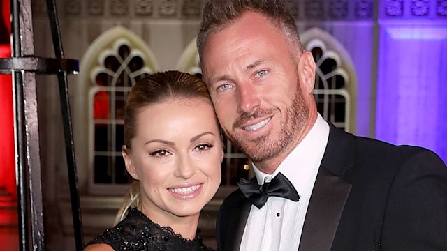 Ola Jordan in a sparkly black dress with James Jordan in a suit