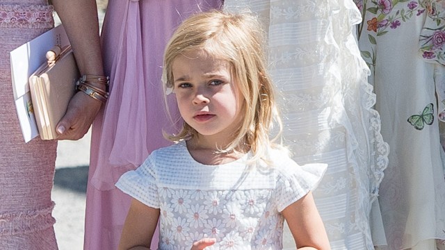 Princess Leonore looking concerned in white flowery dress