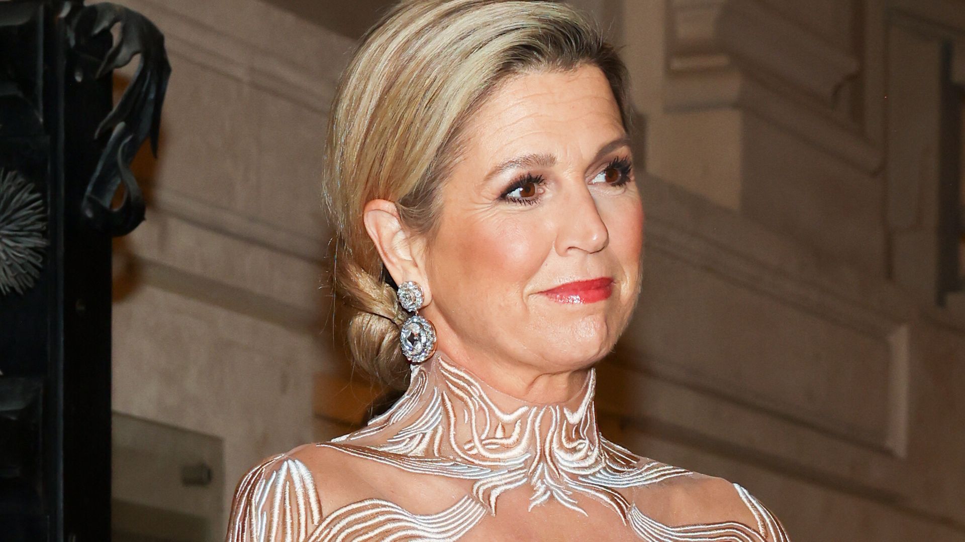 Queen Maxima in a cream sheer dress