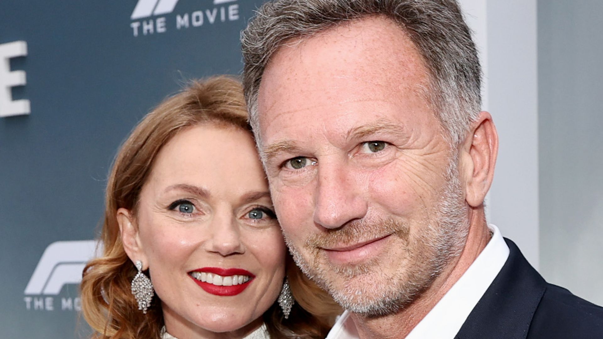 geri and christian horner posing together on red carpet at premiere 