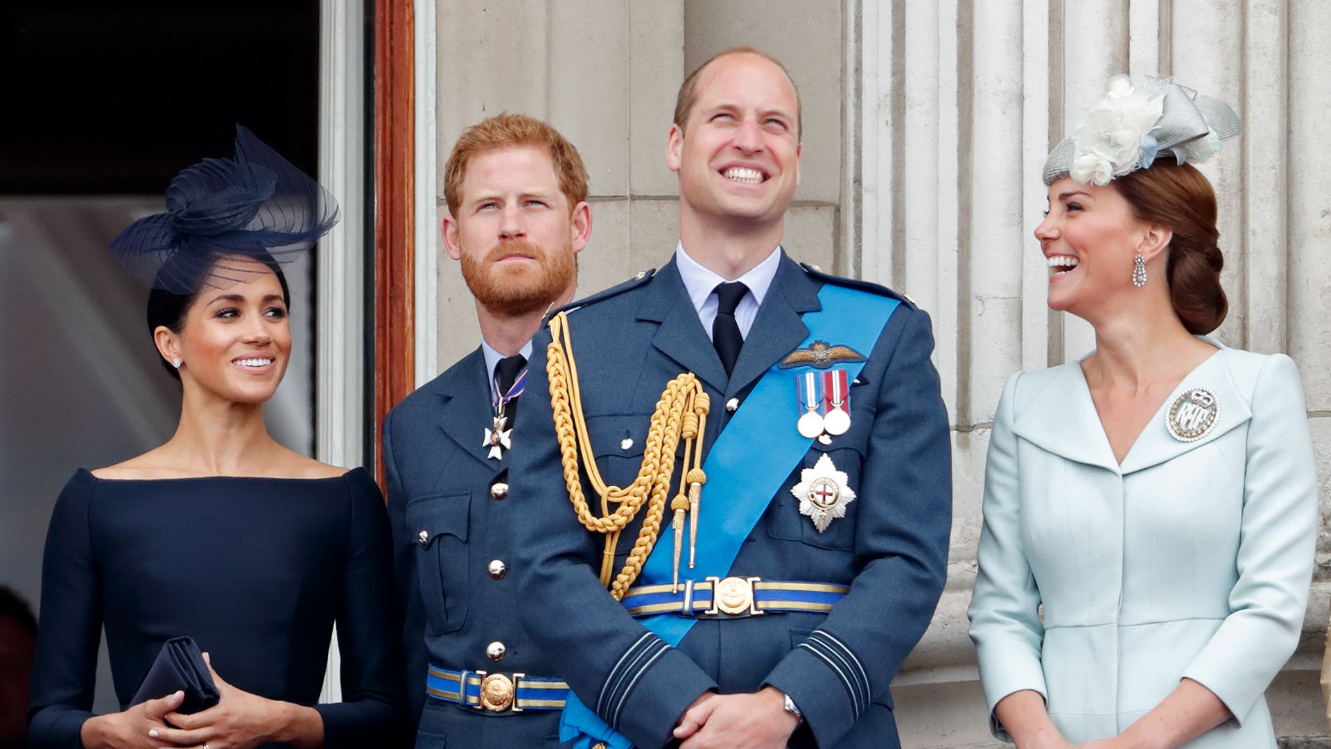 Meghan, Duchess of Sussex, Prince Harry, Duke of Sussex, Prince William, Duke of Cambridge and Catherine, Duchess of Cambridge watch a flypast to mark the centenary of the Royal Air Force from the balcony of Buckingham Palace on July 10, 2018 in London, England.