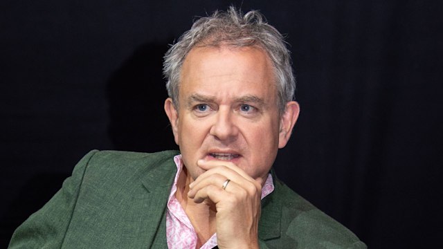 Hugh Bonneville in a green suit 