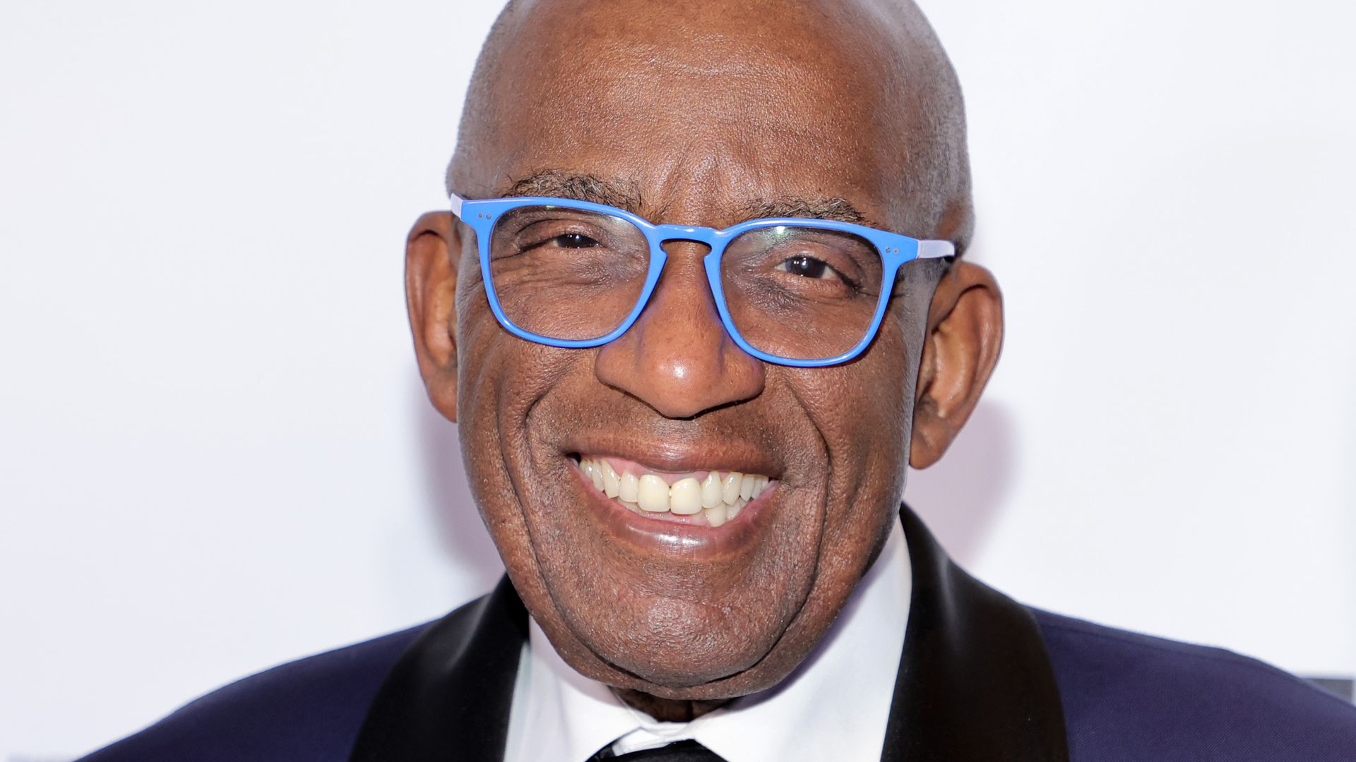 Al Roker wearing blue glasses