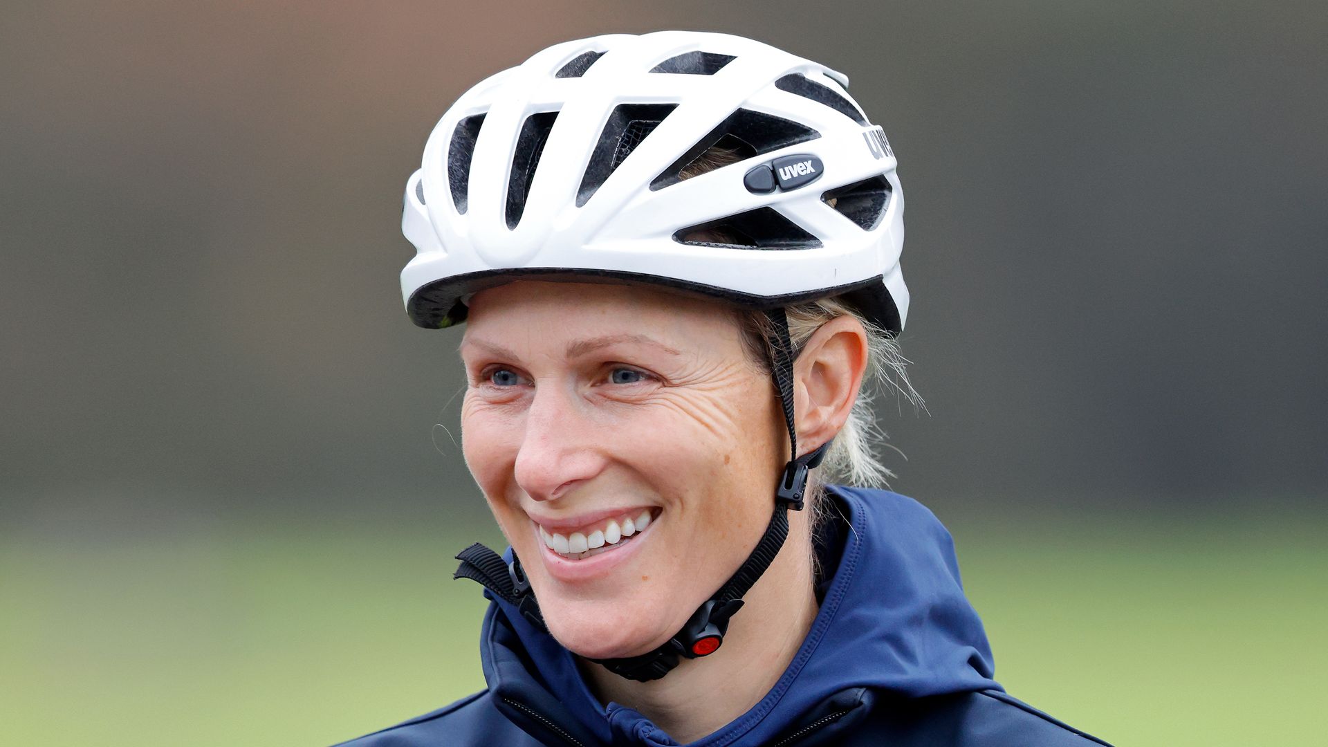 Sporty Zara Tindall looks phenomenal in burgundy leggings on gritty cycle challenge