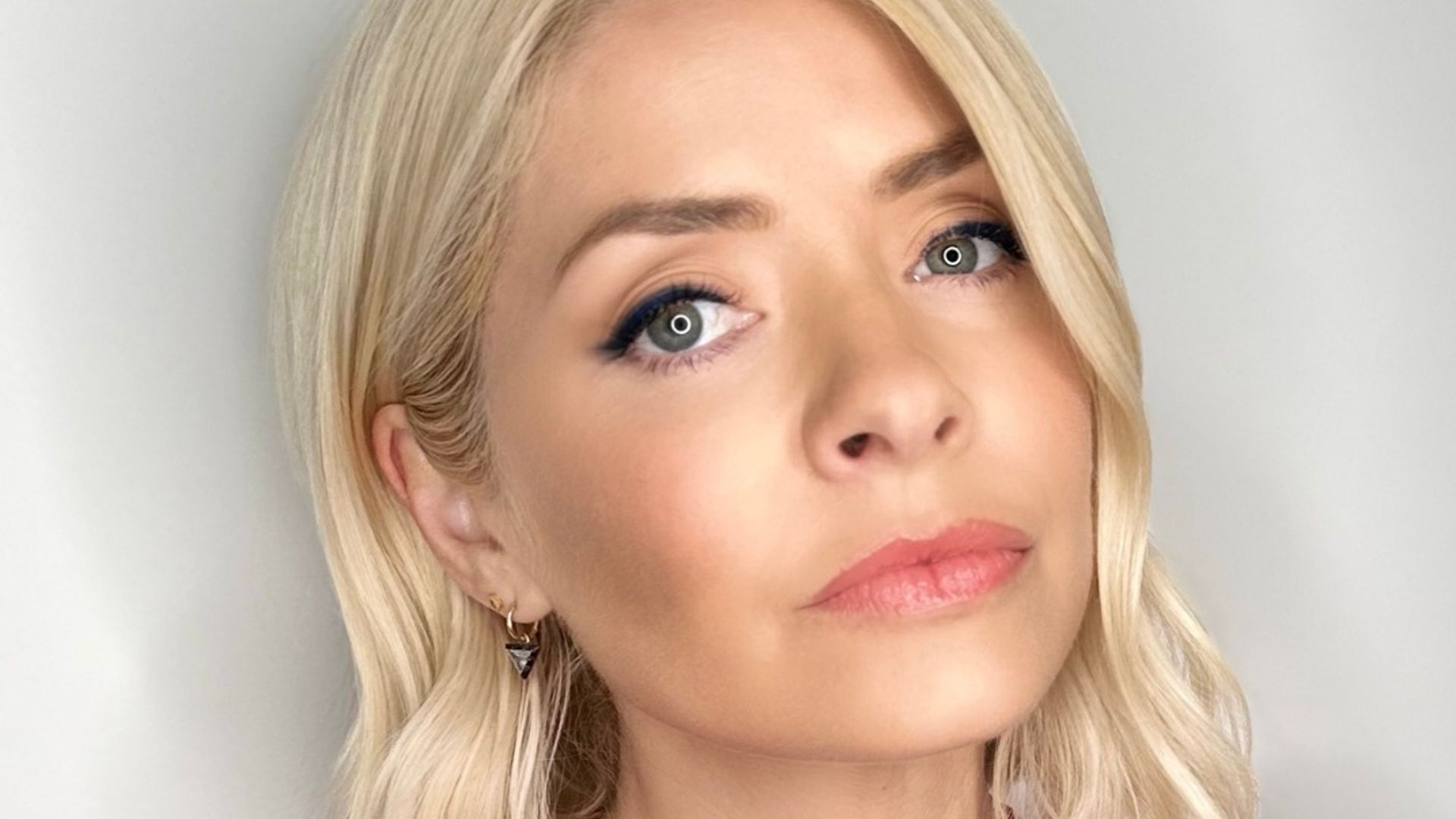 Holly Willoughby showing off her eye makeup in a closeup photo