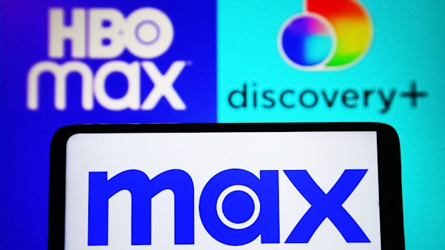 In this photo illustration, Max logo is seen on a smartphone and HBO Max and Discovery+ (Discovery Plus) logos on a pc screen