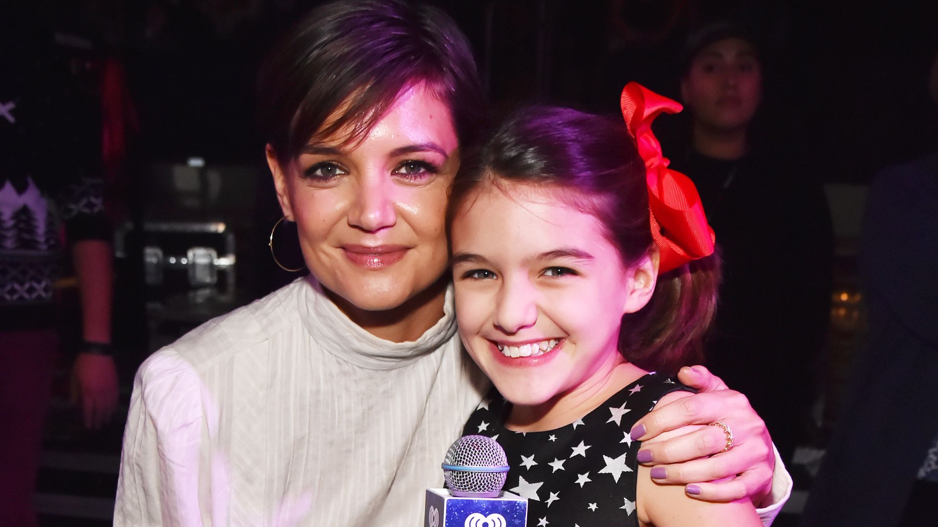 Katie Holmes' lookalike daughter Suri, 17, almost towers over her mother in rare NYC outing