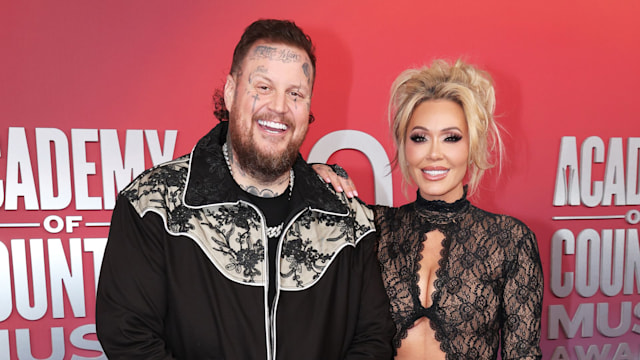 jelly roll and bunnie xo posing together acm awards