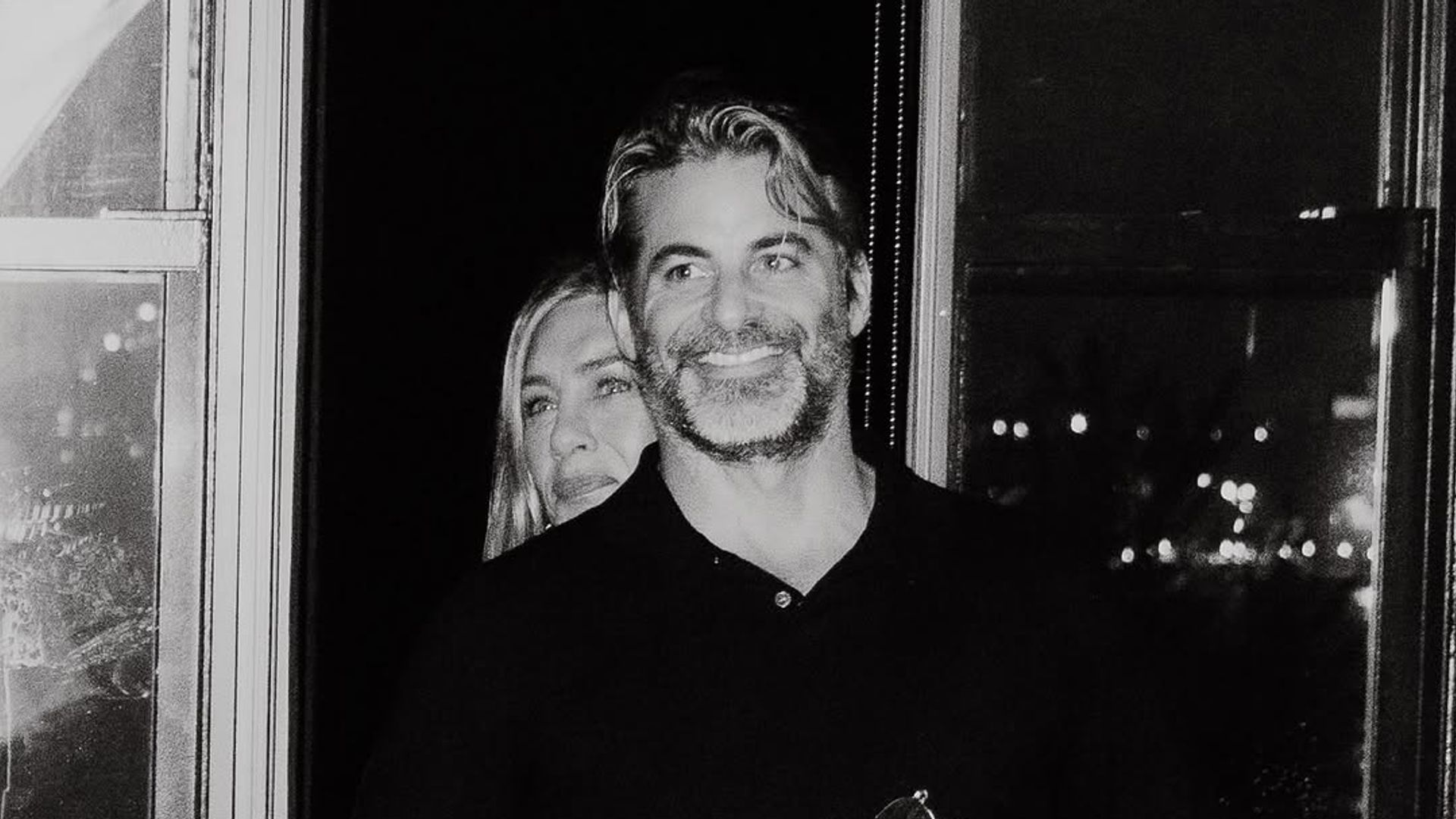 Jennifer Aniston and Jim Curtis embrace in a snap taken at the latter's 50th birthday party, shared on Instagram