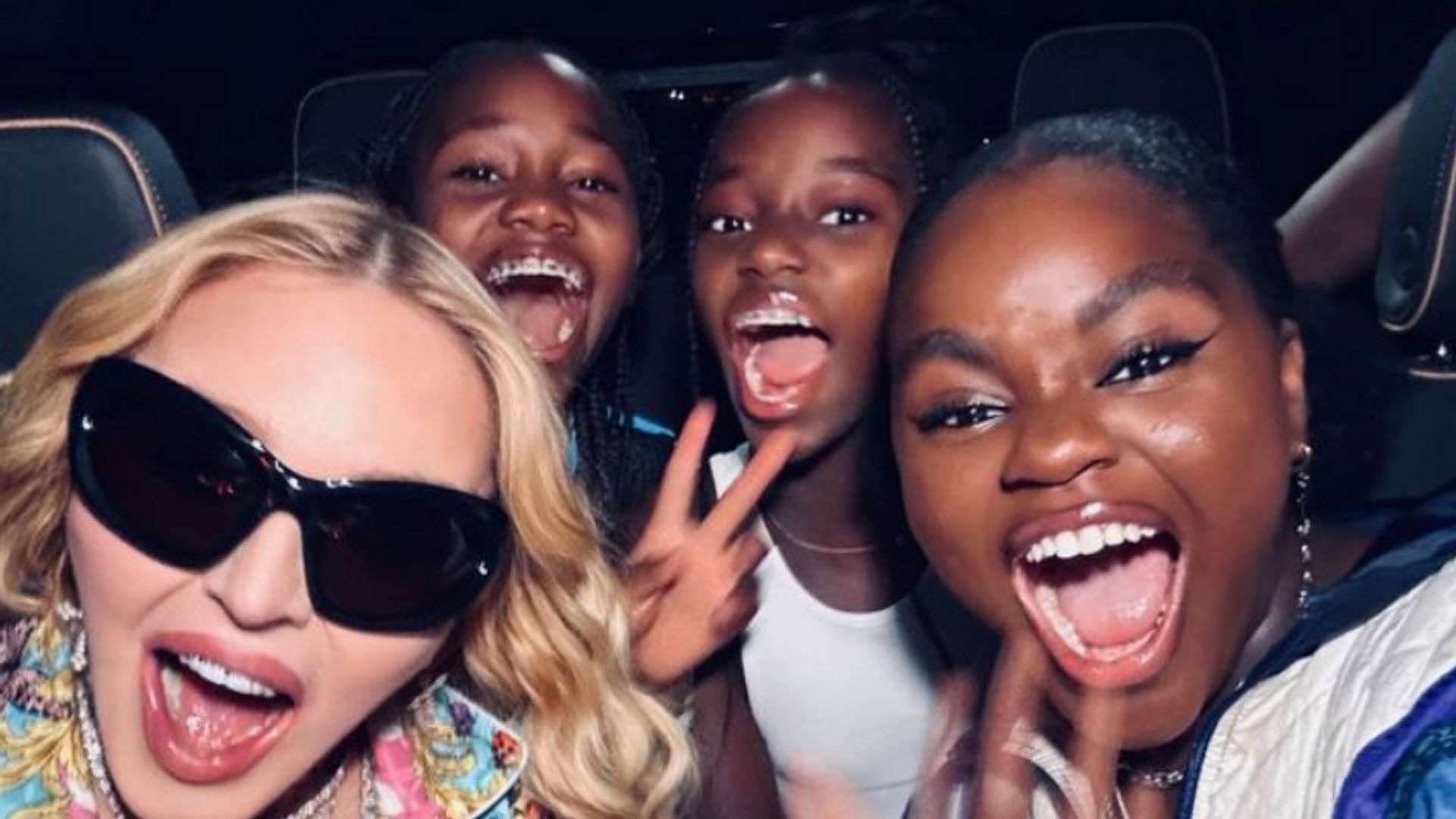 Photo shared by Madonna on her Instagram Stories August 2023 with her daughters, twins Stella and Estere plus Mercy, attending Beyoncé's Renaissance Tour at the MetLife Stadium on July 30.