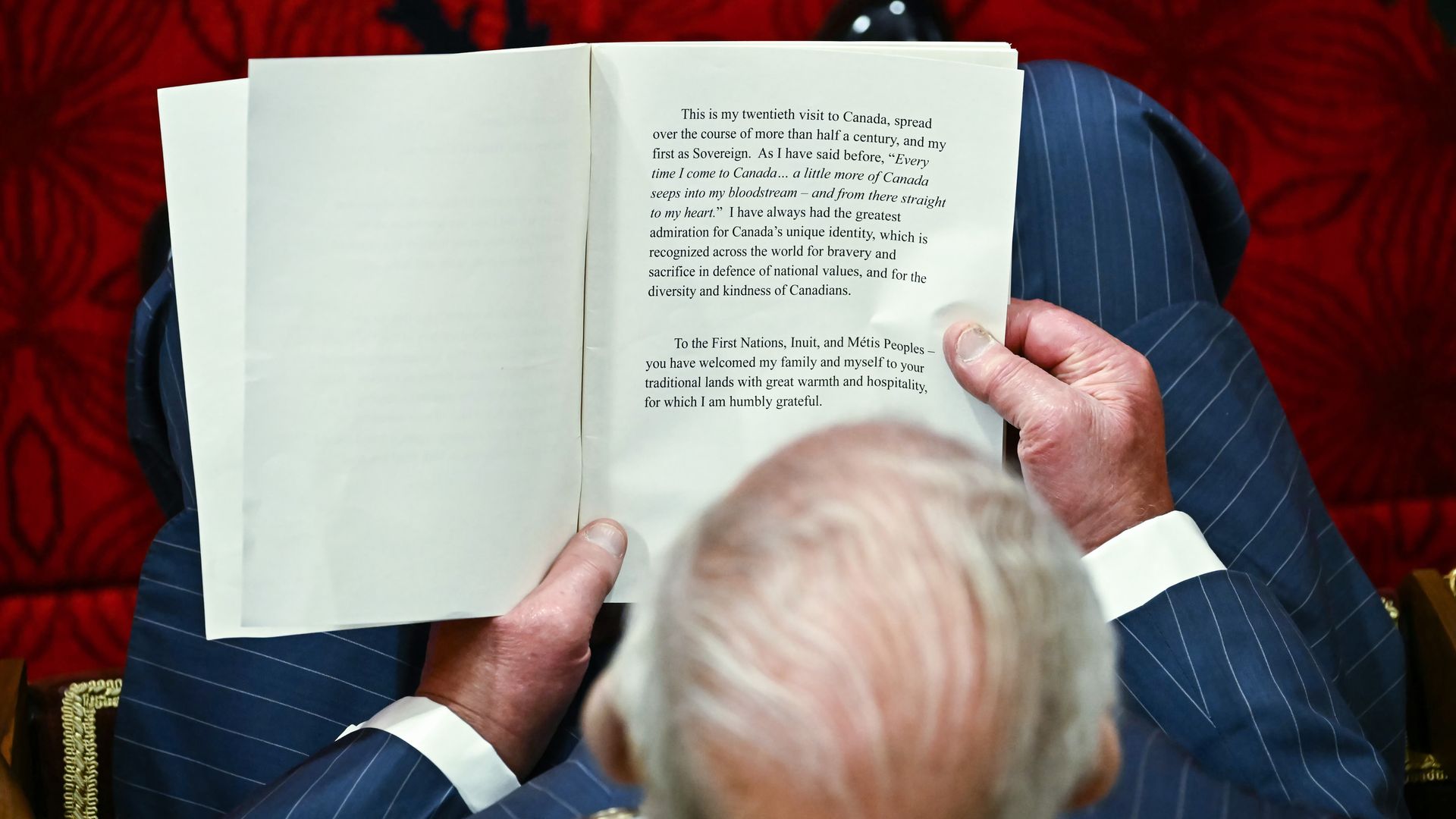 King Charles reading a speech