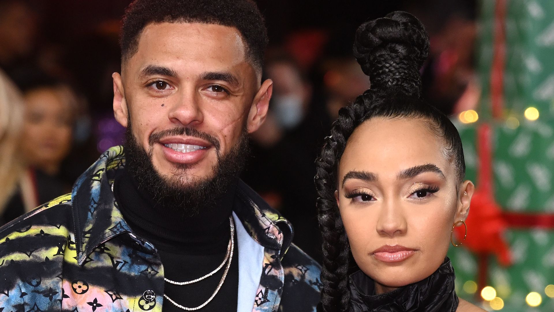 Andre Gray in a colourful jacket and Leigh-Anne Pinnock in a black halterneck dress at the world premiere of Boxing Day