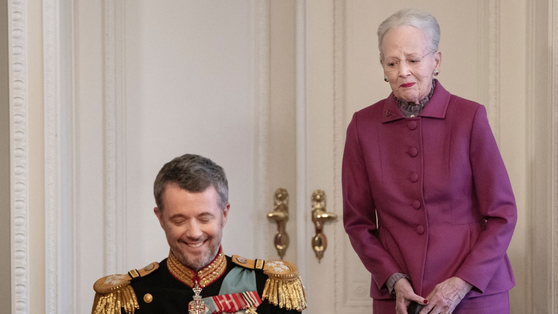 Queen Margrethe II standing behind her son King Frederik X of Denmark 