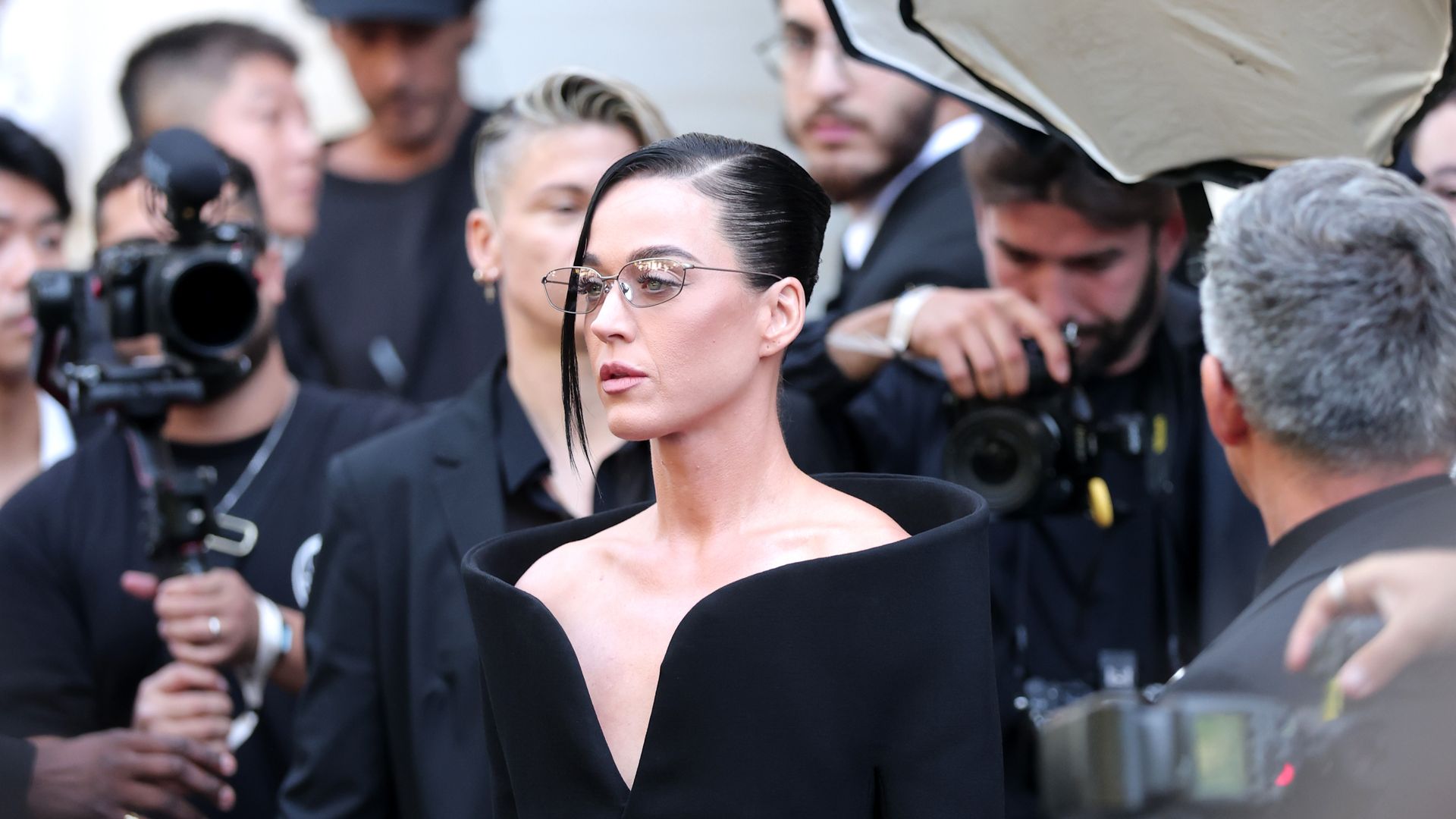 katy perry in glasses and black dress