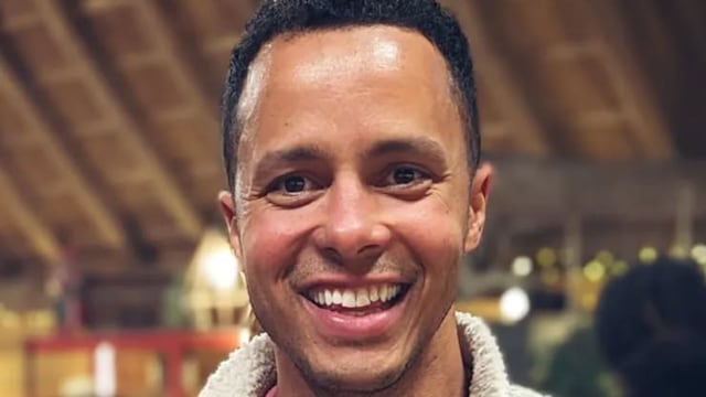 man smiling in white fleece