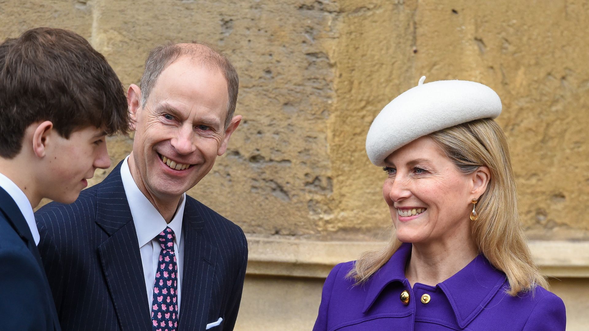 Edward and Sophie looking at son James