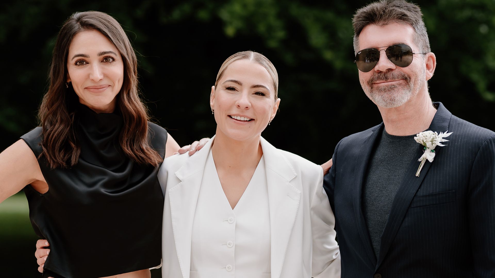 Lucy Spraggan in a white suit with Lauren Silverman and Simon Cowell in black