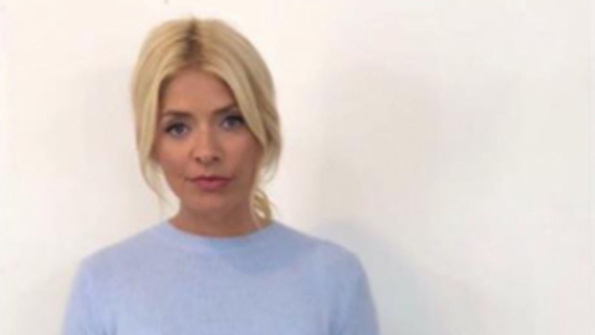 holly willoughby blue top and leather mini skirt