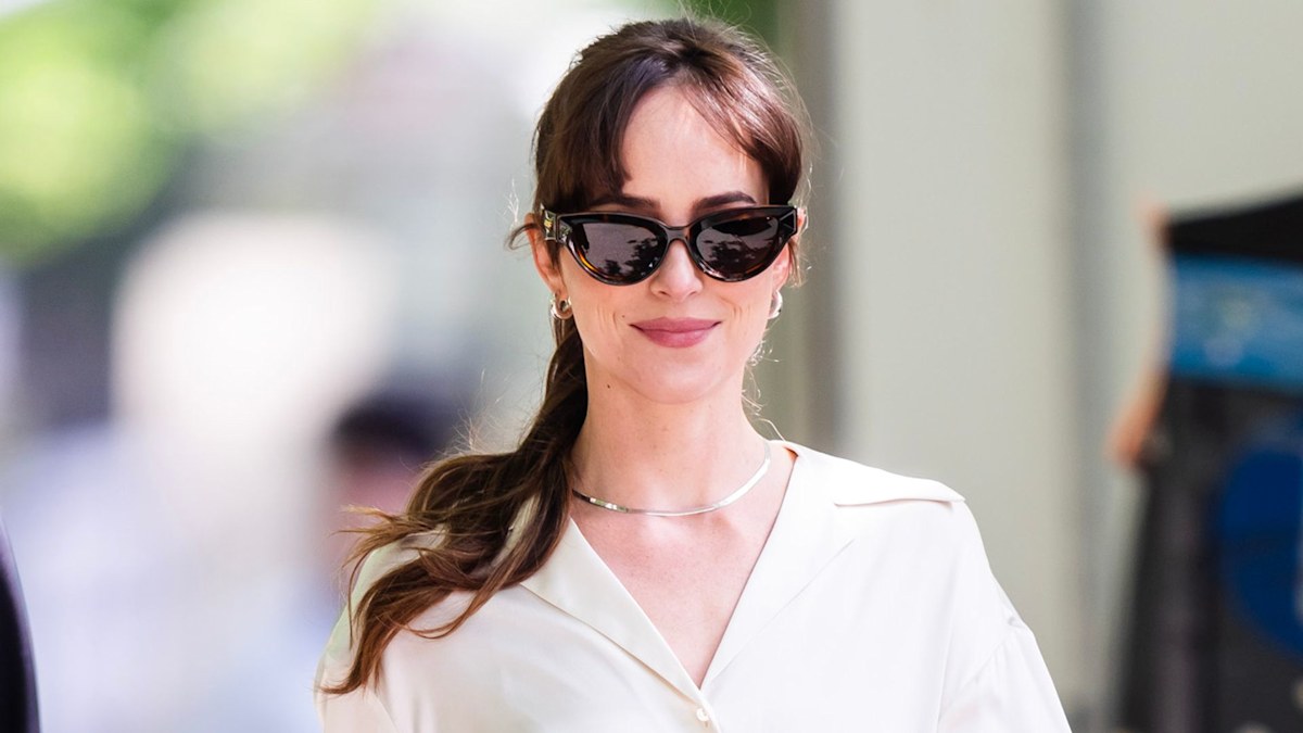 Dakota Johnson’s Adidas and sheer tights combo is perfect for unpredictable spring weather