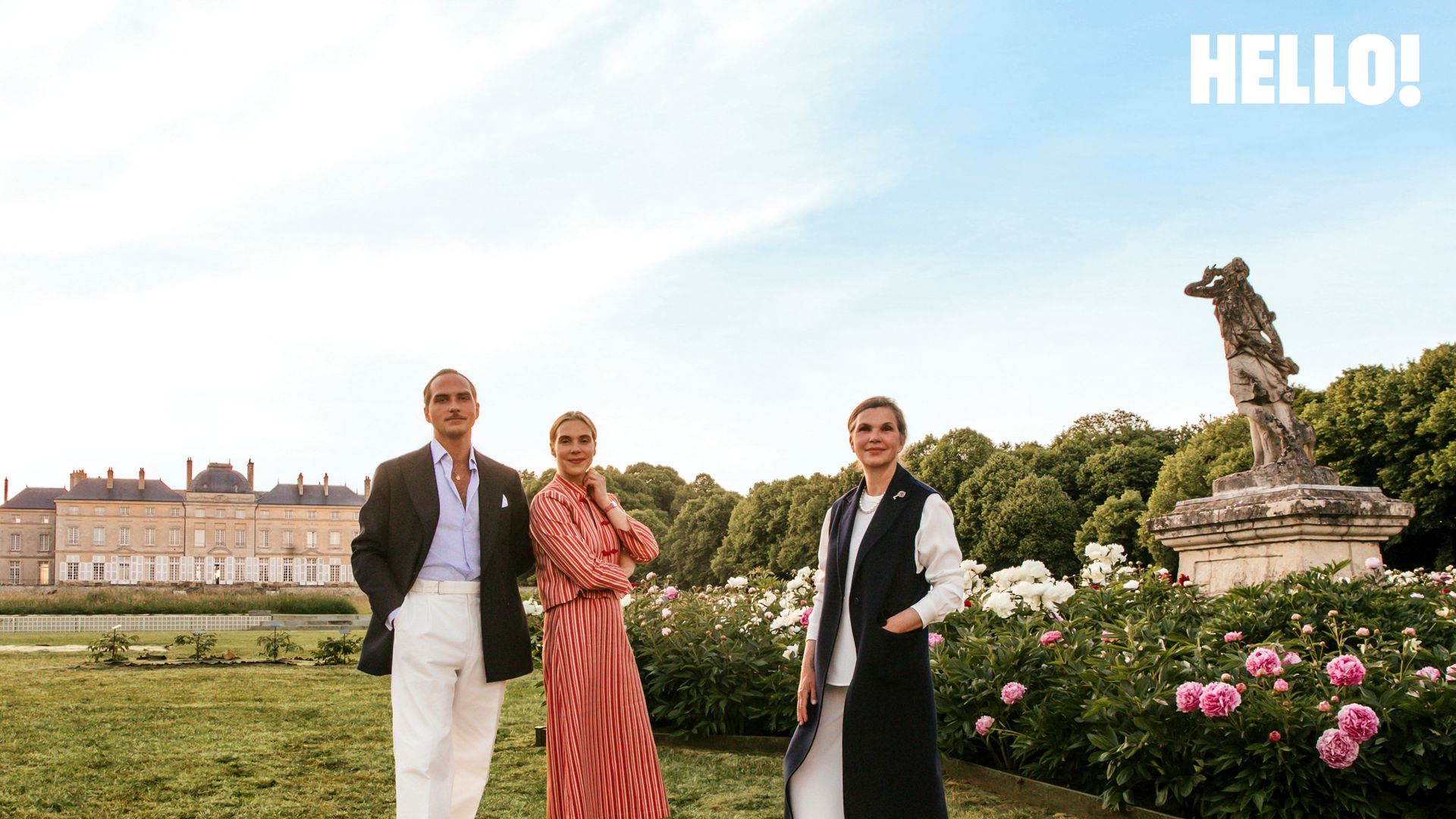 The De Foucaud family posing next to the peony garden with their dog