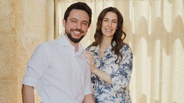 Jordan's Crown Prince Hussein (or Al Hussain), holds his newborn daughter Princess Iman, with his wife, Princess Rajwa, as they leave the King Hussein Medical Centre hospital, in Amman, 