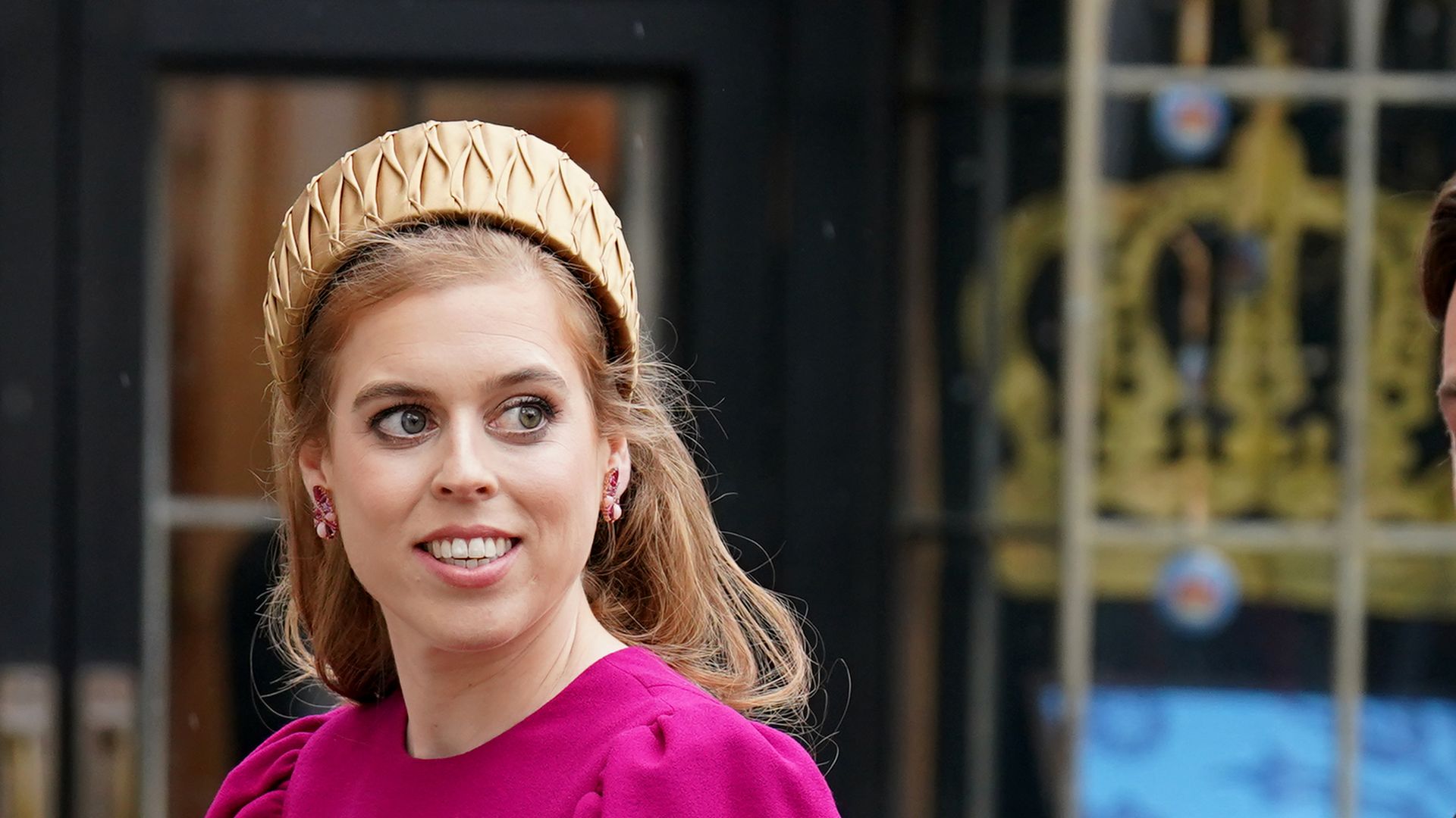 Princess Beatrice stuns in a fushia gown to attend the Coronation of King Charles III 