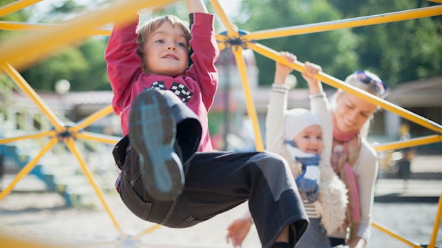 children climbing on a playground - Exciting activities to do with your kids over the summer holidays
